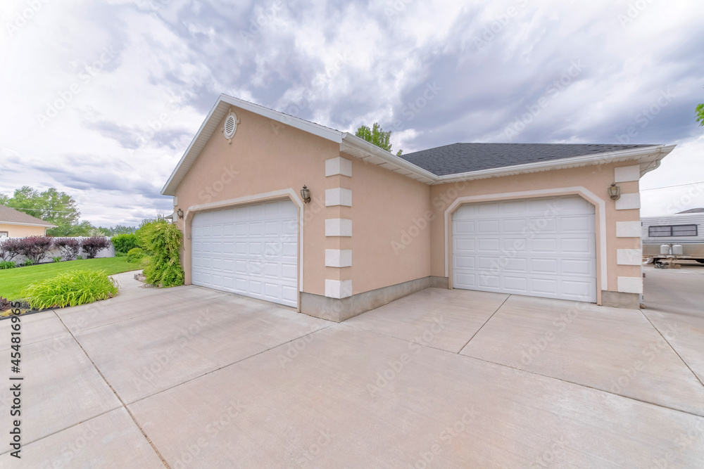 Large, expansive driveway with travel trailer parked out of the way