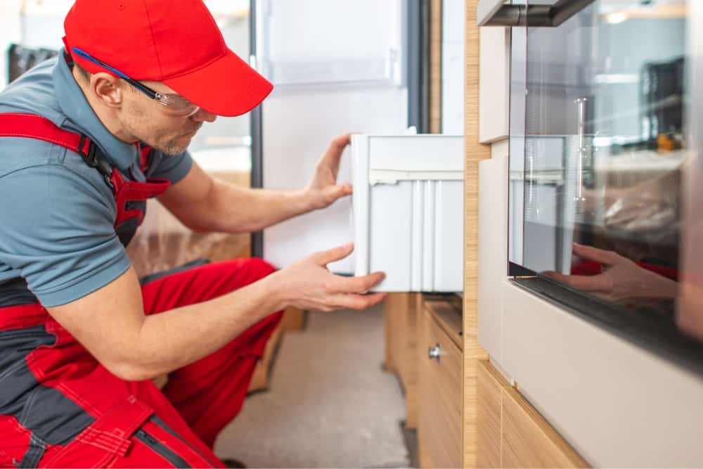 RV technician fixing Appliance Damage